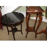 A BLACK PAINTED CIRCULAR TOPPED OCCASIONAL TABLE together with a square topped jardiniere stand