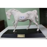 A BESWICK PORCELAIN FIGURINE OF A WHITE HORSE