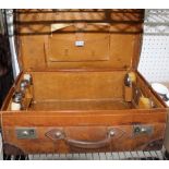 A LARGE LEATHER PART FITTED GENTLEMAN'S VALISE by Rowe & Co. of Rangoon