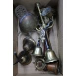 A BOX CONTAINING A SELECTION OF DOMESTIC BRASS WARE to include bells