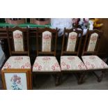 A SET OF FOUR REPRODUCTION DINING CHAIRS with back pads and overstuffed seats