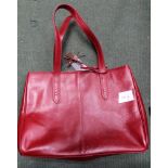 A RED LEATHER LADY'S DESIGNER HANDBAG by Visconti