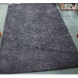 A MODERN CHARCOAL COLOURED SHAG PILE RUG 200cm x 290cm