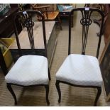 A PAIR OF FIRST QUARTER 20TH CENTURY HIGH BACKED CHAIRS with fancy carved & pierced central slat,