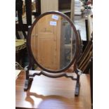 A MAHOGANY FRAMED OVAL PLAIN PLATE DRESSING TABLE MIRROR