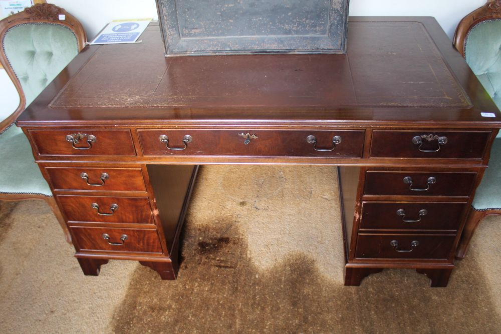 A LARGE MAHOGANY FINISHED THREE PIECE TWIN PEDESTAL DESK with skiver insert top