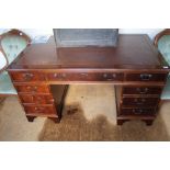 A LARGE MAHOGANY FINISHED THREE PIECE TWIN PEDESTAL DESK with skiver insert top