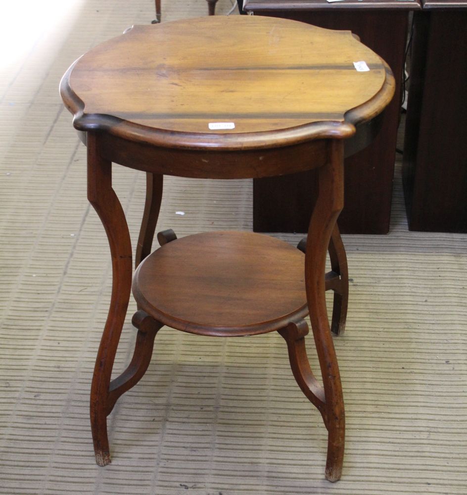 A 19TH CENTURY WALNUT TWO TIER OCCASIONAL TABLE on well-designed legs