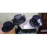 A JOHN LEWIS HAT BOX CONTAINING TWO LADY'S HATS together with a gentleman's bowler, with remains