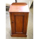 A 19TH CENTURY MAHOGANY BEDSIDE POT CUPBOARD with a single plain panelled cupboard door