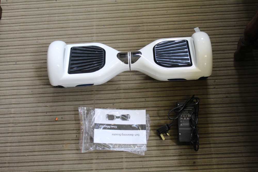 A BRAND NEW BOXED SEGWAY R2 being a self-balancing electric scooter, finished in white complete with