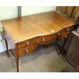 AN EDWARDIAN MAHOGANY LADIES WRITING TABLE with plain top, having single central drawer, flanked