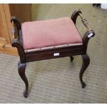 A FIRST QUARTER 20TH CENTURY TWIN HANDLED PAD TOP MUSIC STOOL with lift-up lid and storage box,