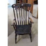 A PROBABLE 19TH CENTURY SLAT BACK COUNTRY KITCHEN ARMCHAIR with solid seat