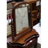 A 19TH CENTURY MAHOGANY ARCHED TOPPED ADJUSTABLE DRESSING TABLE TOP MIRROR on turned uprights &