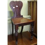 A 19TH CENTURY MAHOGANY HALL CHAIR with fancy shaped back & solid seat