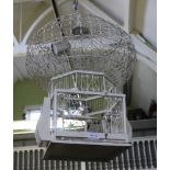 A WHITE PAINTED WOOD & WIRE WORK DECORATIVE BIRDCAGE