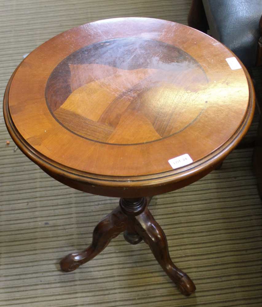 A REPRODUCTION CIRCULAR TOPPED WINE TABLE on turned column, and three downswept legs