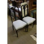 A PAIR OF FIRST QUARTER 20TH CENTURY HIGH BACKED CHAIRS with fancy carved & pierced central slat,