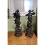 A PAIR OF PART PAINTED FRENCH SPELTER FIGURINES