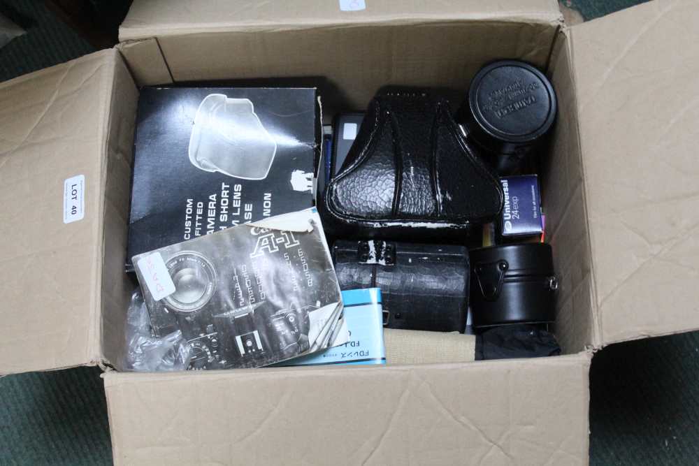 A BOX CONTAINING AN ORIGINAL CANON CAMERA together with lenses, filters, and other accessories