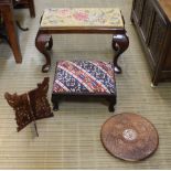 TWO RECTANGULAR PAD TOPPED STOOLS, on cabriole style legs, together with an Indian folding carved