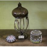 A MODERN GLASS OIL LAMP together with two multi-cane paperweights, one dated 1971