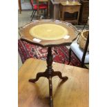 A REPRODUCTION MAHOGANY FINISHED WINE TABLE