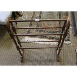 A WOODEN FIVE BAR TOWEL RAIL