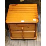 A MODERN PINE LOW BEDSIDE TWO DRAWER CHEST