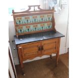 AN EDWARDIAN SATINWOOD WASHSTAND with decorative Art Nouveau design tiled splash back, over a