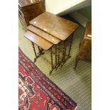 A 20TH CENTURY OAK TALL NEST OF THREE TABLES on barley twist uprights