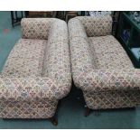 TWO LARGE THREE-SEATER CHESTERFIELD SETTEES supported on show wood legs