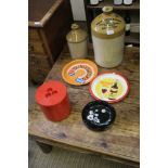 TWO ADVERTISING TIN TRAYS, together with two stoneware spirit crocks, one bearing the legend,