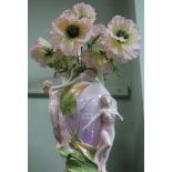 A LARGE DECORATIVE CERAMIC VASE containing everlasting oversized flowers