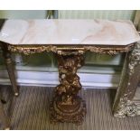 AN ONYX TOPPED MODERN CONSOLE TABLE having fancy pierced moulded gilded base, held aloft by a