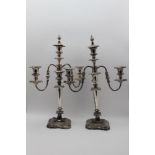 A PAIR OF SILVER PLATED TABLE CANDELABRA, triple light, twin branch design, with snuffing caps, 50cm