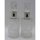 PREECE & WILLICOMBE, A PAIR OF SILVER MOUNTED CUT GLASS DECANTERS of cylindrical form, the collars