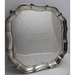 BARKER BROTHERS SILVER LTD, A SQUARE FORM SILVER TRAY, with piecrust rim, raised on four outswept