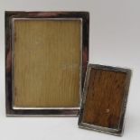 A STERLING SILVER PHOTOGRAPH FRAME, for an image 12cm x 9cm, together with a smaller one, Birmingham