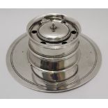 JOHN GRINSELL & SONS, A SILVER CAPSTAN FORM DESK INKWELL, the hinged cover conceals ceramic liner,