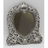 WILLIAM COMYNS, A LATE 19TH CENTURY SILVER MOUNTED DRESSING TABLE MIRROR, embossed and pierced