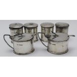 TWO MID 20TH CENTURY THREE-PIECE SILVER CONDIMENTS of Georgian design, comprising; two salts, two