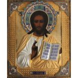 A Russian icon of Christ Pantocrator in a gilded silver and cloisonné enamel oklad, with enamelled