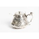 A George III silver mustard with decorative swags and head of a soldier to handle with marks for