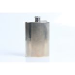 A silver engine turned hip flask with marks for Birmingham 1949 and Dudley Russel Howitt. Approx.