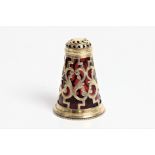 A Victorian silver pepper pot with red glass liner and screw base with marks for London 1850 and