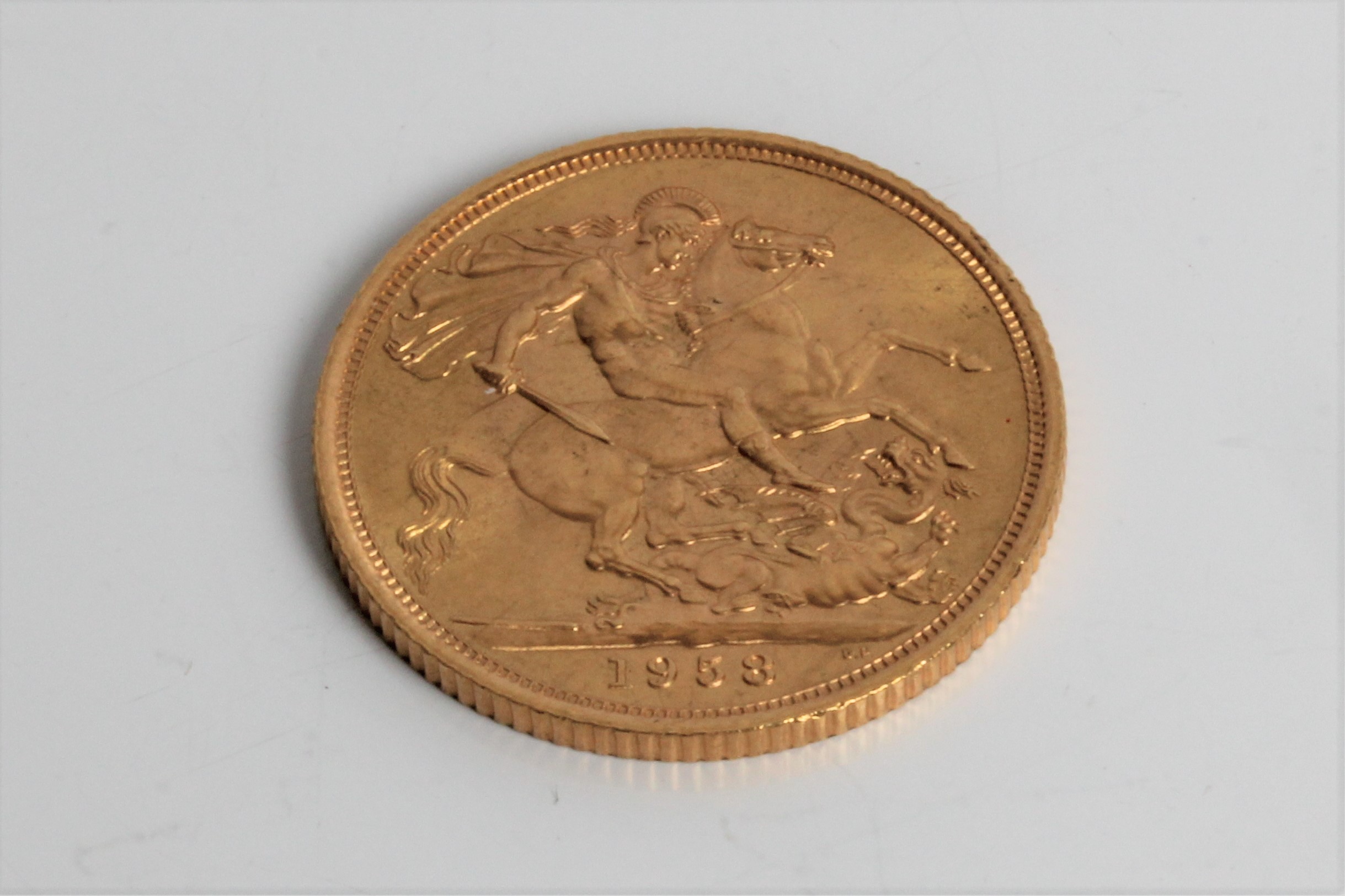 An Elizabeth II dated 1958 full Sovereign. Important: Online viewing and bidding only. No in