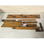 Quantity of various wooden rulers and other measuring tools. Important: Online viewing and bidding