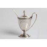 A Victorian silver mustard pot, engraved with '4th Oct 1883' and eagle, with swag and bow
